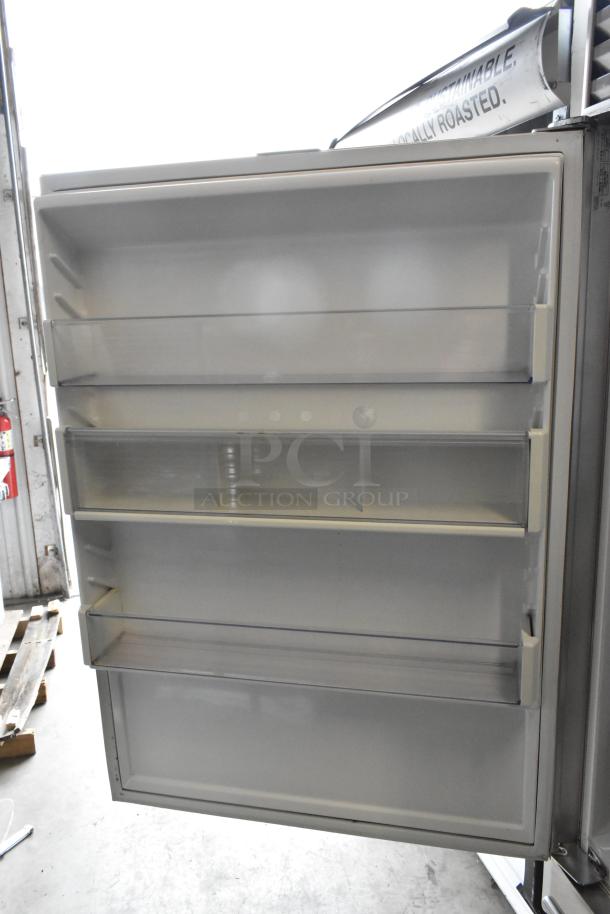 Sub Zero 650/S 2 stainless steel cooler with freezer drawer, open door view. Includes interior shelving, 115V, 1 phase.