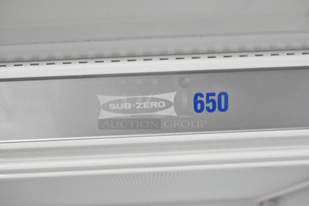 Sub Zero 650/S 2 stainless steel cooler with freezer drawer, 115V, 1 phase. Featuring model number on interior panel.