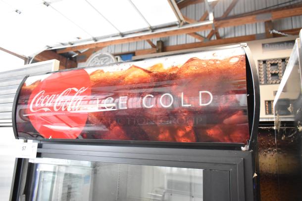 True GDM-26EM commercial cooler with a single glass door, Coke branding. Features poly-coated racks, 115V, 1 phase.