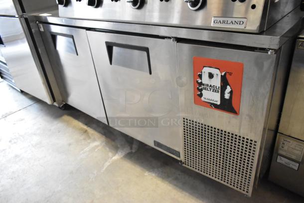 2017 True TWT-67F stainless steel 2-door undercounter freezer, commercial casters, 115V, 1-phase, red "Miracle Seltzer" decal.