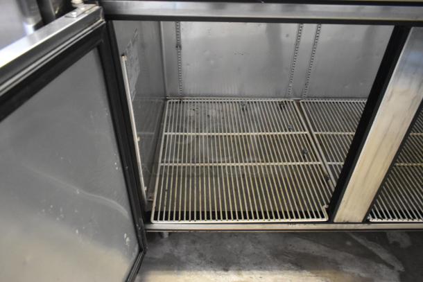 2017 True TWT-67F stainless steel 2-door undercounter freezer, commercial casters, 115V, 1 phase, interior view.