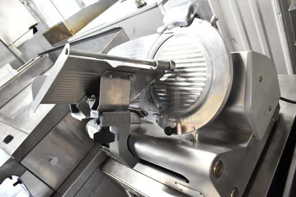 Globe stainless steel commercial countertop meat slicer with blade sharpener, 115 volts, 1 phase, excellent condition.