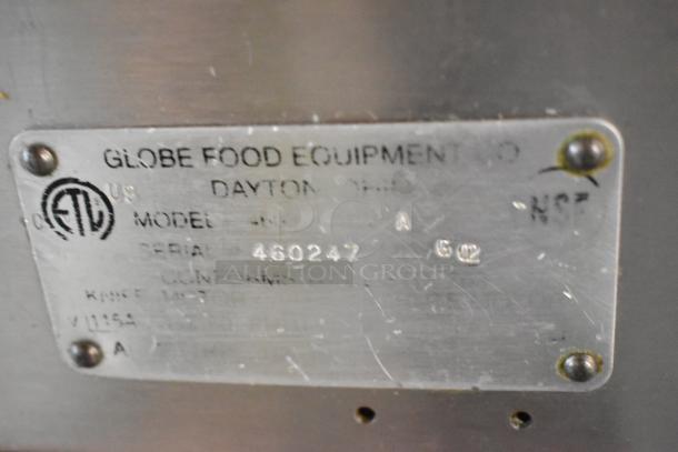 Globe stainless steel commercial meat slicer with built-in blade sharpener. Features 115 volts, 1 phase. Serial number 460247.