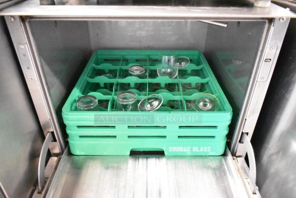 Jackson AvengerHT stainless steel undercounter dishwasher with a green glass rack inside, labeled "Sundae Glass."
