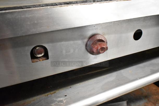 Wolf stainless steel countertop gas griddle on stand, featuring control knobs, durable construction, used condition.