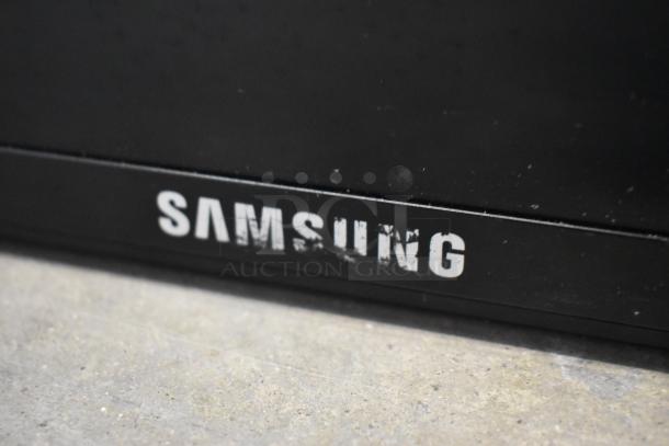 Samsung ME46B Television, 120 Volts, 1 Phase, visible white logo, slight wear on logo. Buyer must pick up; no shipping.