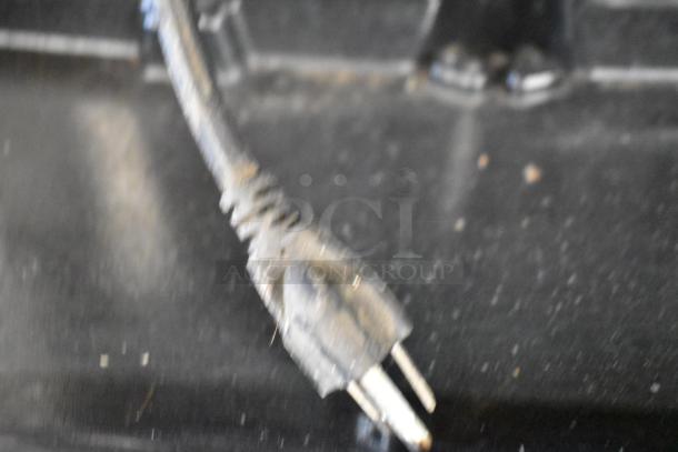 Close-up of a power plug connector for a stainless steel commercial beverage machine, Cornelius CB1522AHK6.