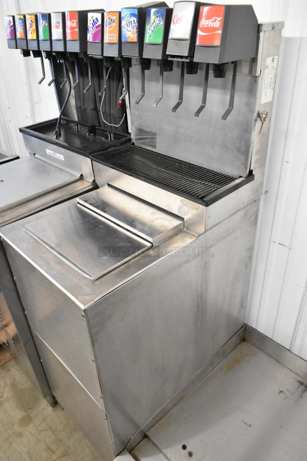 2 stainless steel 6-flavor beverage machines on ice bins, featuring Cornelius CB1522AHK6, 115V, 1 Phase, good condition.