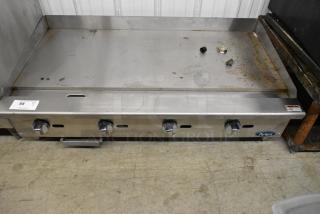 Atosa stainless steel commercial countertop gas griddle, four knobs, used condition with visible signs of use. Brand logo visible.