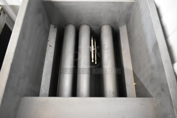 Cook Rite ATFS-40 fryer interior, stainless steel, natural gas powered, 102,000 BTU, with visible oil level marking.