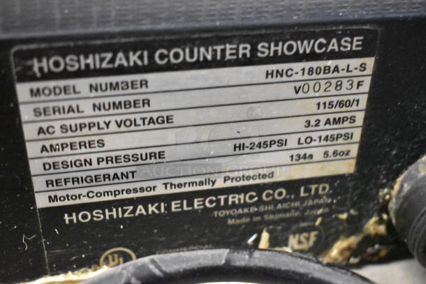 Hoshizaki HNC-180BA-L-S sushi display case label, showing model details, 115V, 3.2 amps, thermally protected.