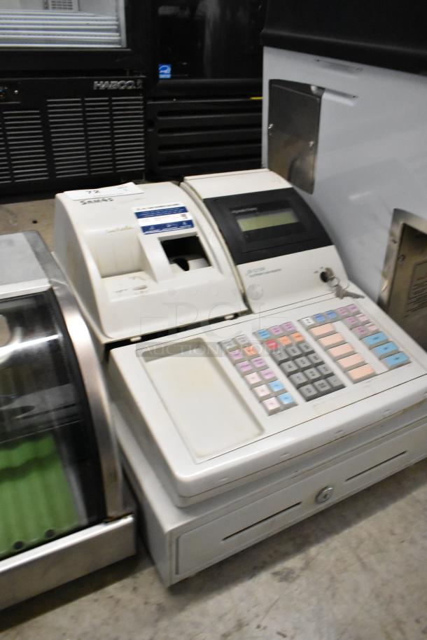 Sam4s ER-5215M electronic cash register, white, countertop model. Features numeric keypad, receipt printer, display. 120V, 1 phase.