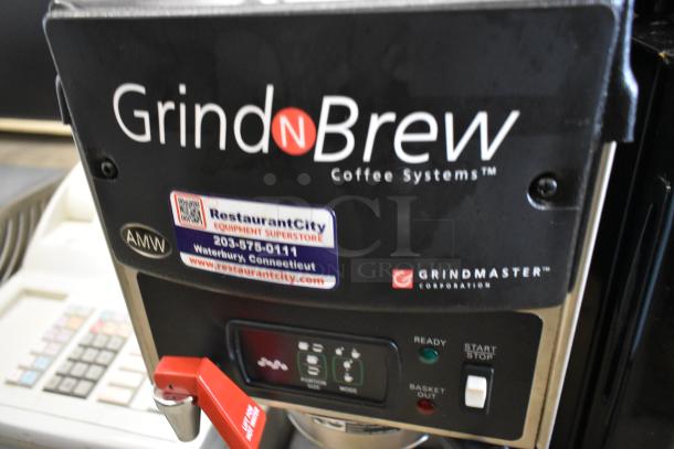 Brand new Grindmaster Grind'n Brew-10H stainless steel coffee grinder and maker with hot water dispenser, model details visible.