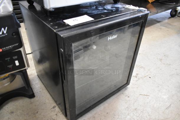 Haier HBCN02EBB metal mini cooler merchandiser, black, glass door, 115 volts, 1 phase, excellent condition, branded front.