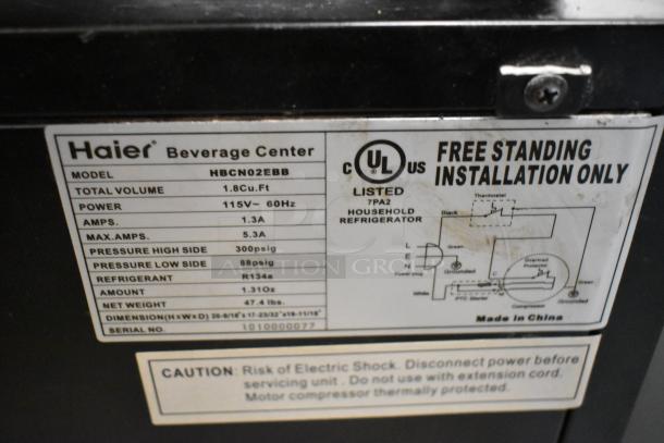 Haier HBCN02EBB Metal Mini Cooler Merchandiser label, 115V, 1 phase, 1.8 Cu.Ft, listing technical specifications and warnings.