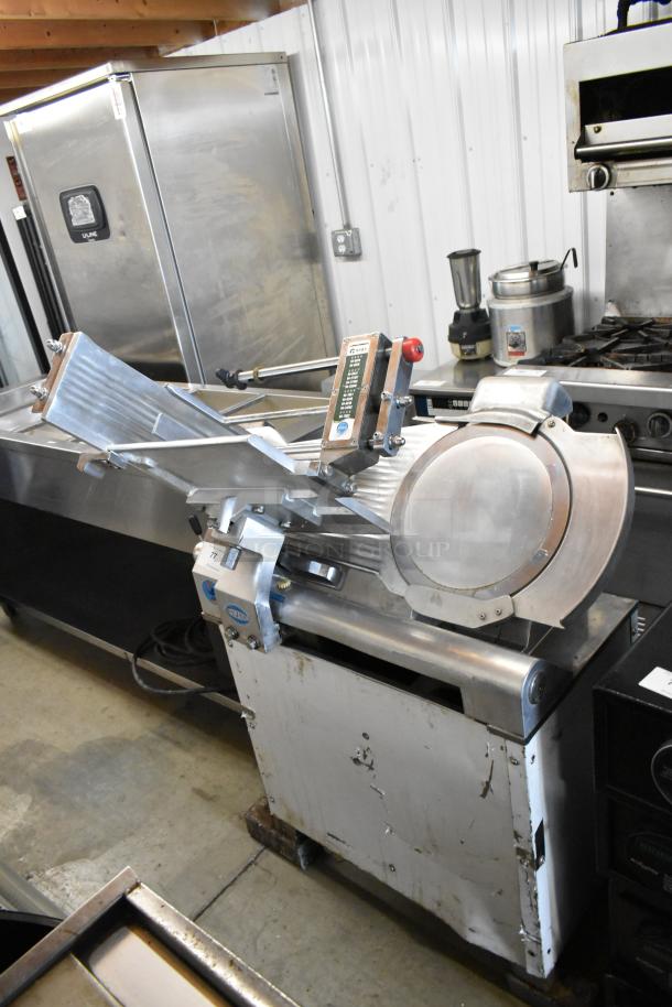Fujee HFS-350S commercial meat slicer, metal design, floor style, 220 volts, visible control panel, well-used condition.