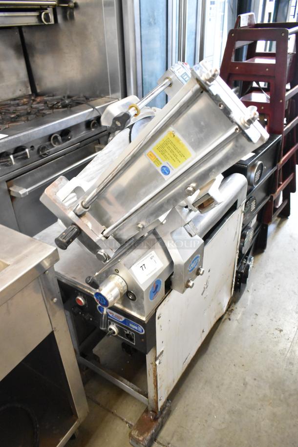 Fujee HFS-350S metal commercial meat slicer, 220 volts, floor style; used condition with visible labels and controls.