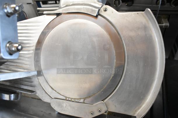 Fujee HFS-350S metal commercial meat slicer, floor style, 220 volts, in used condition featuring a large circular blade.