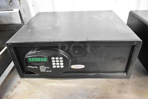 Black metal single compartment safe with digital keypad. No combination included. Suitable for secure storage.