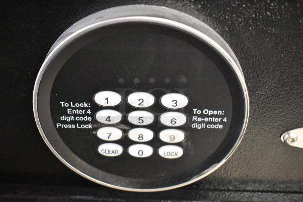 2 black metal safes with single compartments, keypad locks. No combinations included. Auction: 2x bid value.
