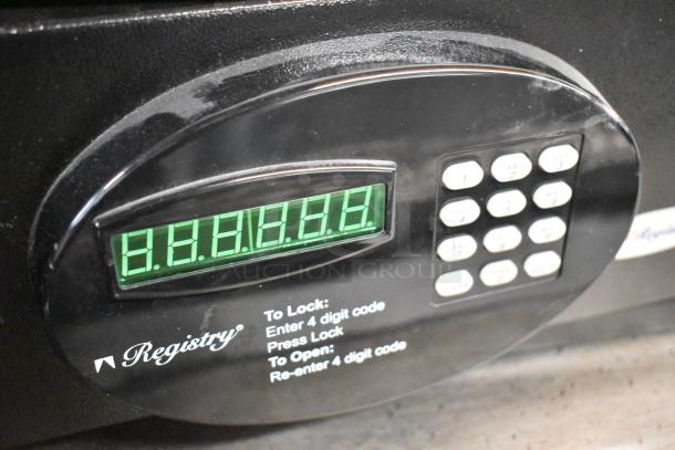 Two black metal single compartment safes, brand "Registry," with digital keypad; sold without combination.