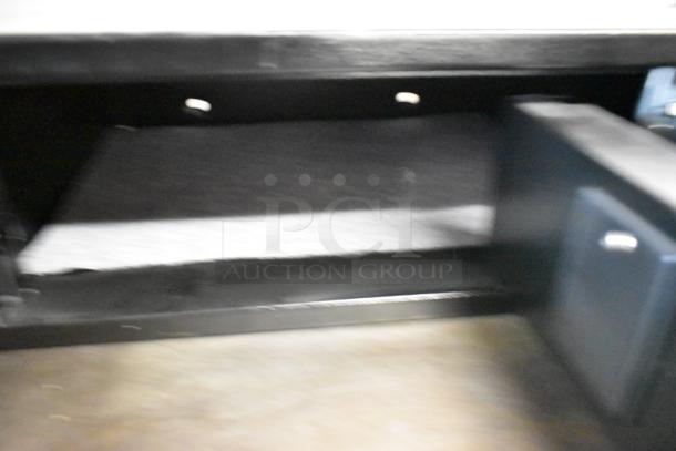 Black metal single compartment safe, no combination, interior view, used, solid construction, auction item.
