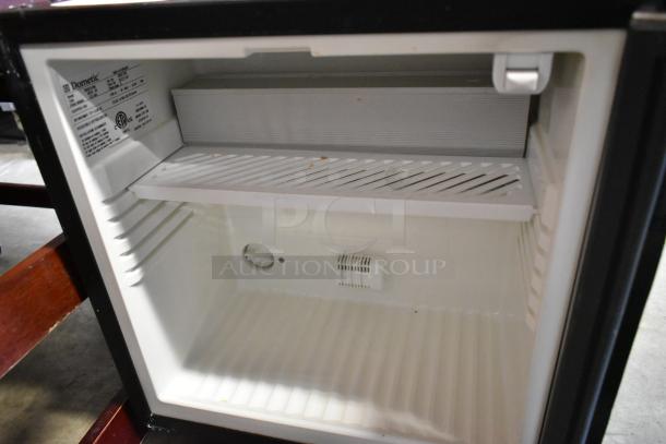 Dometic RH023LDAG Metal Mini Cooler Merchandiser, 115V, 1 Phase, white interior, open door, manufacturer label visible.