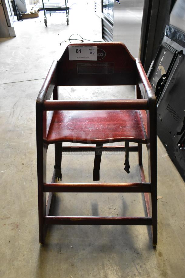 4 Winco wooden high chairs, sturdy design, visible wear, dark finish, safety strap included, auction label indicating quantity x4.
