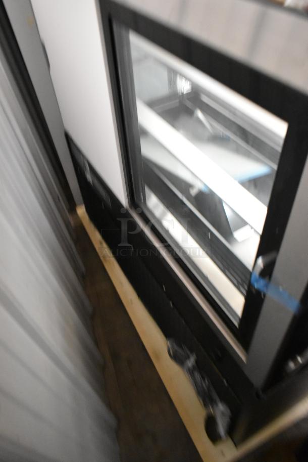 Brand new Avantco 193BCD48B 48" black dry bakery display case with curved glass. Note glass damage. 115V, 1 phase.