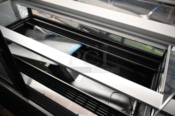 Brand new Avantco 193BCD48B 48" curved glass black dry bakery display case. Note visible glass damage. 115V, 1 phase.