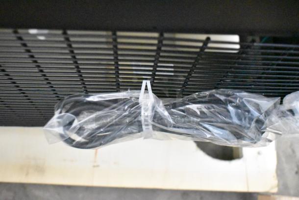 Avantco 193BCD48B bakery display case power cord wrapped in plastic under black grill.