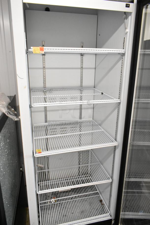 2019 Habco SE18 commercial reach-in cooler, metal build, single door, poly-coated racks, 115 volts, 1 phase. Appears in good condition.