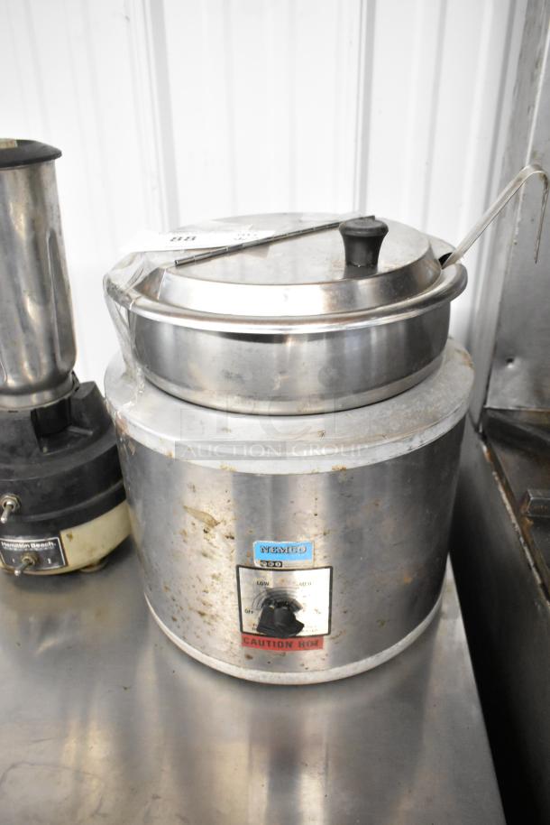 Hamilton Beach blender and Nemco countertop soup kettle warmer, both in used condition; visible labels indicate brand and caution.