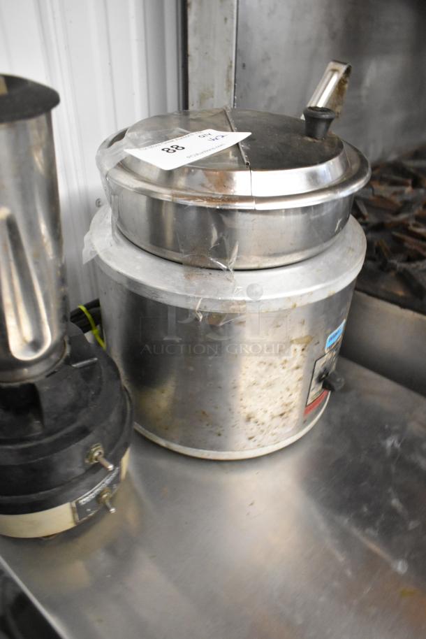 Hamilton Beach blender and Nemco countertop soup kettle food warmer, both in used condition on a metal surface.