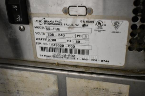 Alto Shaam 500-TH/III label shows specifications: 208-240V, 1 phase, 2700 watts. Includes service hotline and serial number.