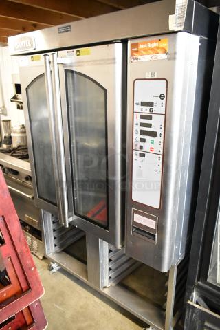 Baxter OV310G Stainless Steel Natural Gas Mini Rotating Rack Oven with dual pan rack, commercial casters, control panel.