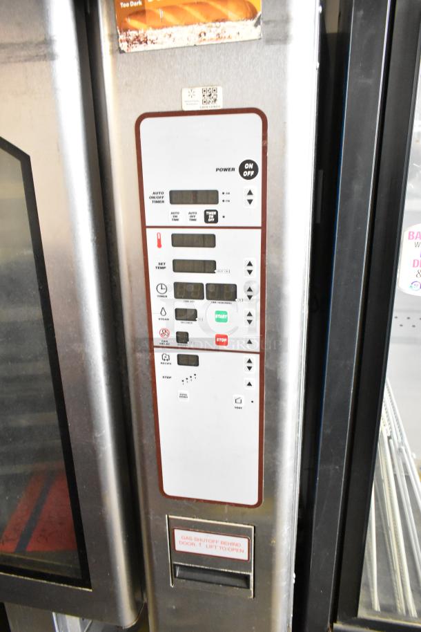 Baxter OV310G stainless steel commercial gas-powered mini rotating rack oven, features control panel, dual pan rack, on casters.
