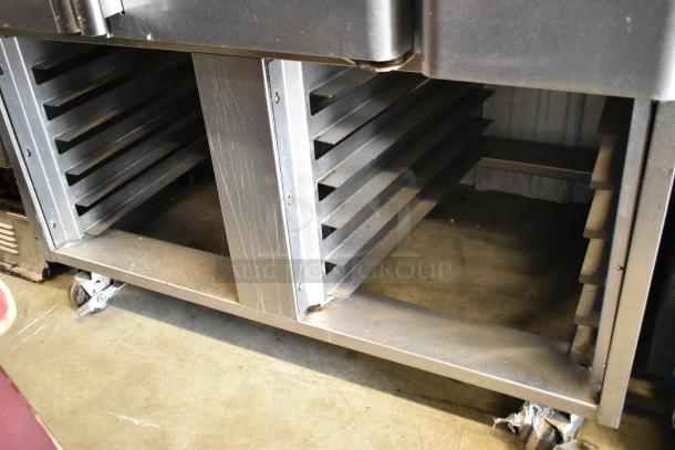 Baxter OV310G stainless steel rotating rack oven, natural gas, dual pan rack, commercial casters, used condition.