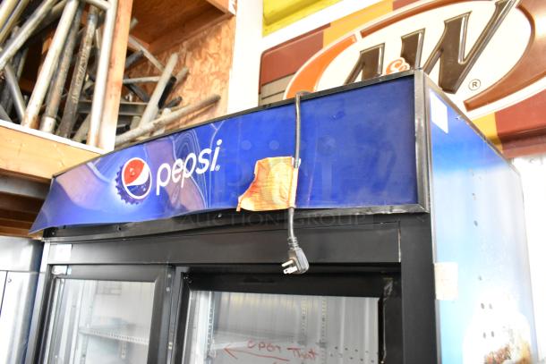 QBD CD45-HC Metal Commercial Reach-In Cooler, 2 doors, Pepsi logo, poly coated racks, 115V, 1 phase, visible wear.