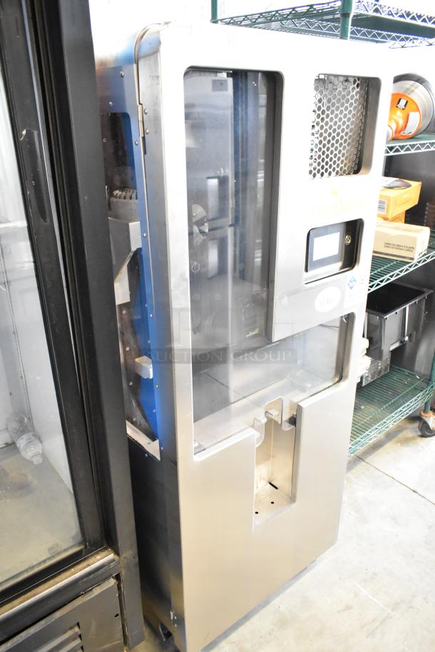 Stainless steel Fresh N Squeeze 2ND-GEN-MFJ-HE commercial citrus juicer on casters, 120V, 1 phase, floor style.