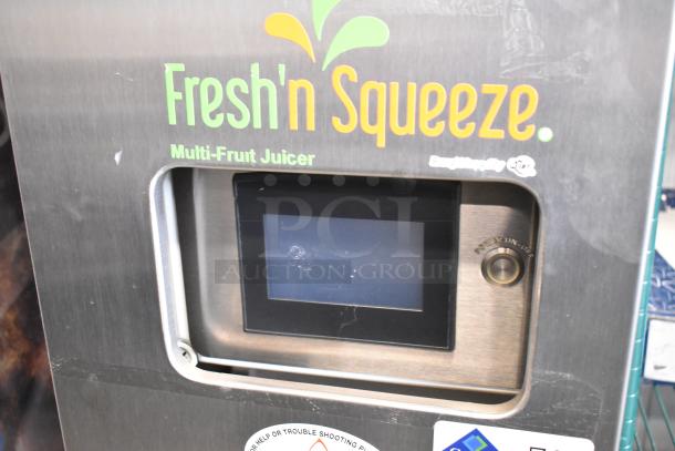 Stainless steel Fresh N Squeeze 2ND-GEN-MFJ-HE citrus juicer, multi-fruit juicing, touchscreen, commercial casters.