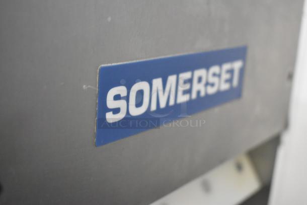 Stainless steel Somerset CDR-100P commercial countertop dough sheeter with brand label, 115 volts, 1 phase.