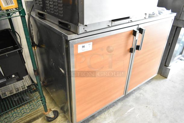 Duke RUF-48 stainless steel 2-door work top cooler on commercial casters, 120V, 1 phase, with wooden finish doors.