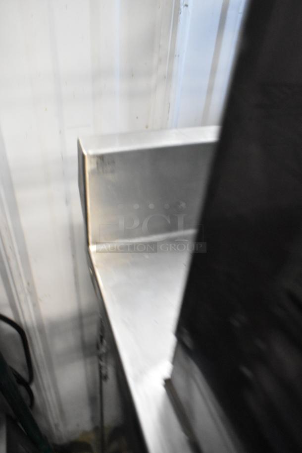 Duke RUF-48 stainless steel commercial 2-door work top cooler on casters, shown in fair condition.