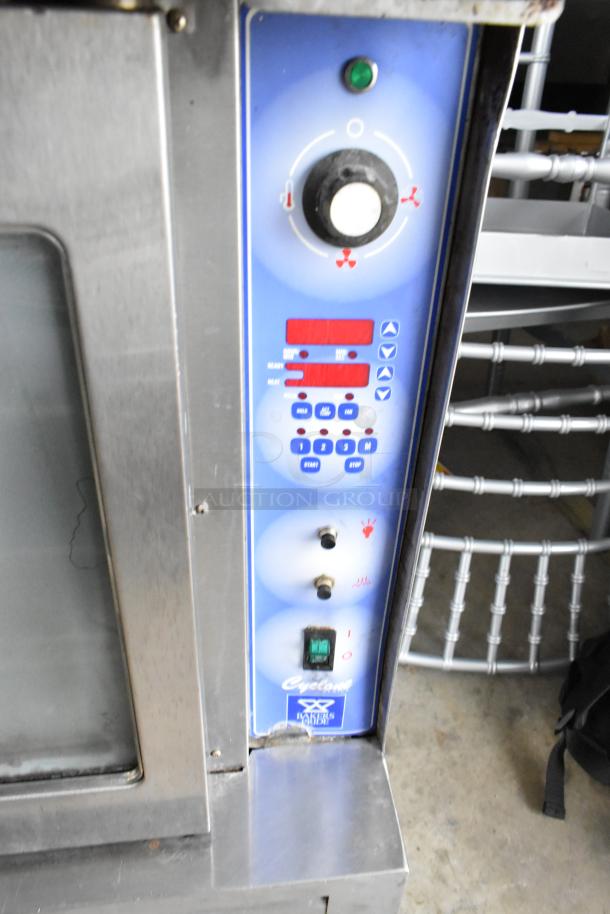 Bakers Pride stainless steel convection oven, gas-powered, with view-through doors, metal racks, and thermostatic controls.
