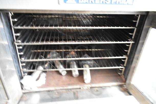 Bakers Pride stainless steel commercial gas convection oven with view-through doors, metal racks, and thermostatic controls.