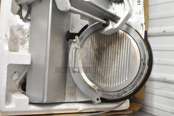 2018 Bizerba GSP H metal meat slicer, 120 volts, 1 phase. Visible wear, includes enclosed blade and adjustment handles.