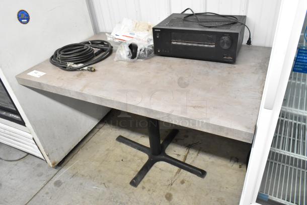 Dining height table with contents including an Onkyo AV receiver, coiled cables, and miscellaneous items, in good condition.