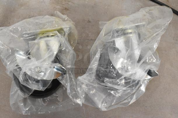 Plastic-wrapped metal casters for dining height table, new condition, set on floor.