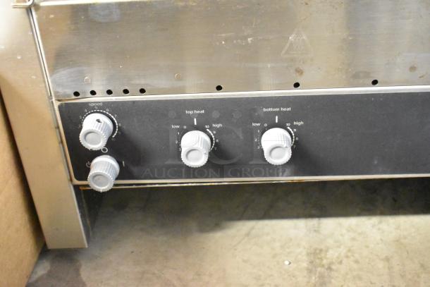 Vollrath JT3H CT4H-220950 stainless steel conveyor toaster oven. Adjustable knobs for speed, top, and bottom heat. 220V.